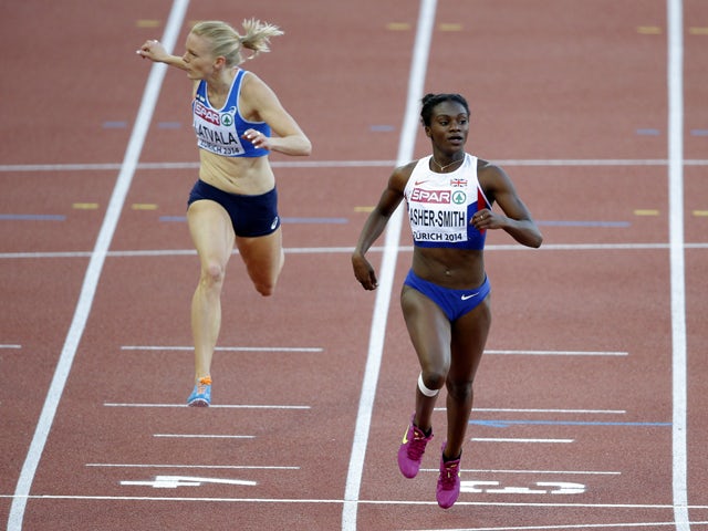 Dina Asher-Smith of Great Britain crosses the finish line ahead of Hanna-Maari Latvala of Finland during the Women's 200 metres semi-final during day three of the 22nd European Athletics Championships at Stadium Letzigrund on August 14, 2014