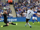 Everton's Irish midfielder Aiden McGeady scores the opening goal past Leicester's Danish goalkeeper Kasper Schmeichel during the English Premier League football match between Leicester City and Everton at King Power Stadium in Leicester, central England o