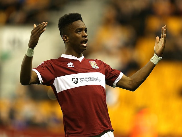 Ivan Toney of Northampton Town celebrates after scoring his sides 2nd goal during the Capital One Cup First Round match against Wolves on August 12, 2014