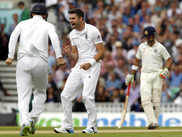 Englands James Anderson celebrates taking the wicket of Indias Murali Vijay for 2 runs on the third day of the fifth cricket Test match between England and India at The Oval cricket ground in London on August 17, 2014