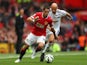 United's Javier Hernandez is chased by Jonjo Shelvey of Swansea on August 16, 2014