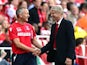 Arsenal boss Arsene Wenger shakes hands with Crystal Palace's caretaker manager Keith Millen on August 16, 2014