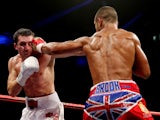 Kell Brook catches Vyacheslav Senchenko with a straight left during their Final Eliminator for the IBF World Welterweight Championship bout at Motorpoint Arena on October 26, 2013