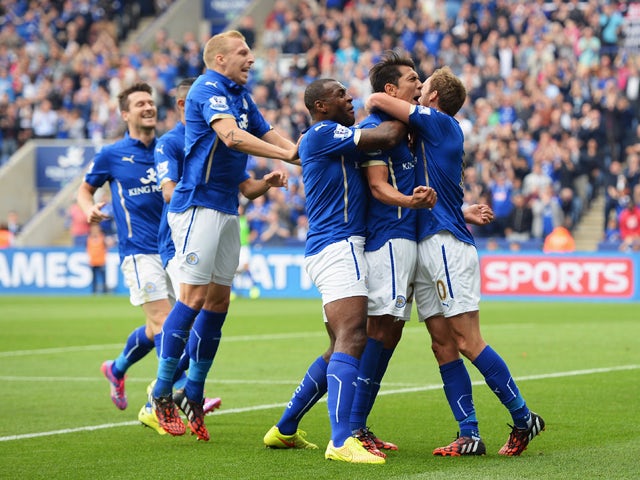 Leonardo Ulloa of Leicester City celebrates scoring his goal with team mates during the Barclays Premier League match between Leicester City and Everton at the King Power Stadium on August 16, 2014