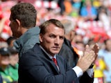 Liverpool's Northern Irish manager Brendan Rodgers applauds before the start of the English Premier League football match between Liverpool and Southampton at Anfield stadium in Liverpool, northwest England, on August 17, 2014