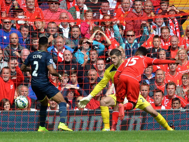 Liverpool's English striker Daniel Sturridge scores his team's second goal past Southampton's English goalkeeper Fraser Forster during the English Premier League football match between Liverpool and Southampton at Anfield stadium in Liverpool, northwest E