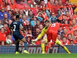 Liverpool's English striker Daniel Sturridge scores his team's second goal past Southampton's English goalkeeper Fraser Forster during the English Premier League football match between Liverpool and Southampton at Anfield stadium in Liverpool, northwest E