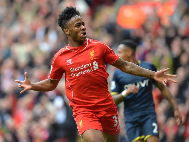 Liverpool's English midfielder Raheem Sterling celebrates scoring the opening goal during the English Premier League football match between Liverpool and Southampton at Anfield stadium in Liverpool, northwest England, on August 17, 2014