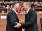 United boss Louis van Gaal and Swansea manager Garry Monk shake hands prior to their clash at Old Trafford on August 16, 2014