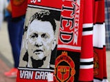Louis van Gaal scarves on sale outside of Old Trafford prior to Man Utd's opening game of the season with Swansea on August 16, 2014