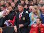 Manchester United Manager Louis van Gaal takes his seat prior to the Barclays Premier League match between Manchester United and Swansea City at Old Trafford on August 16, 2014