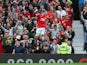 Wayne Rooney of Manchester United celebrates scoring his team's first goal during the Barclays Premier League match between Manchester United and Swansea City at Old Trafford on August 16, 2014