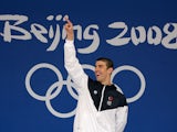 Gold medalist Michael Phelps of the United States celebrates on the podium during the medal ceremony for the Men's 100m Butterfly Final held at the National Aquatics Centre during Day 8 of the Beijing 2008 Olympic Games on August 16, 2008