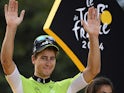 Slovakia's Peter Sagan celebrates his green jersey of best sprinter on the podium on the Champs-Elysees avenue in Paris on July 27, 2014