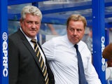 Steve Bruce the Hull City manager and Harry Redknapp the QPR manager look on Barclays Premier League match between Queens Park Rangers and Hull City at Loftus Road on August 16, 2014