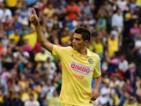 Raul Jimenez of America celebrates a goal against Atletico de Madrid during their EuroAmerican Cup football match at the Azteca Stadium, in Mexico City, on July 30 2014