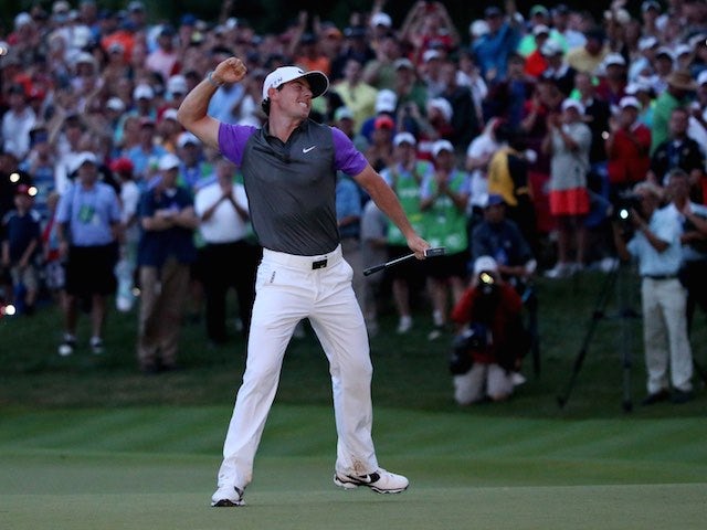 Rory McIlroy celebrates winning the PGA Championship on August 10, 2014