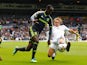 Leeds's Stephen Warnock slides in to take the ball from Albert Adomah of Middlesbrough on August 16, 2014