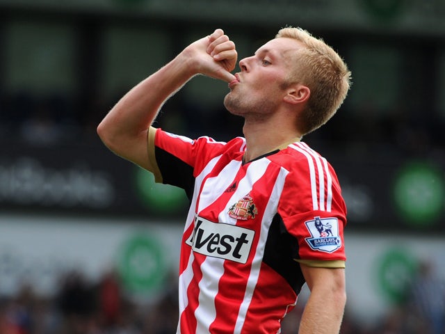 Sunderland player Seb Larsson celebrates after he had scored the second goal during the Barclays Premier League match between West Bromwich Albion and Sunderland at The Hawthorns on August 16, 2014