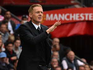 Swansea City's English manager Garry Monk gestures during the English Premier League football match between Manchester United and Swansea City at Old Trafford in Manchester, north west England on August 16, 2014