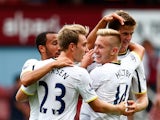 Eric Dier of Spurs is congratulated by teammates after scoring the match winning goal during the Barclays Premier League match between West Ham United and Tottenham Hotspur at Boleyn Ground on August 16, 2014