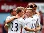 Eric Dier of Spurs is congratulated by teammates after scoring the match winning goal during the Barclays Premier League match between West Ham United and Tottenham Hotspur at Boleyn Ground on August 16, 2014
