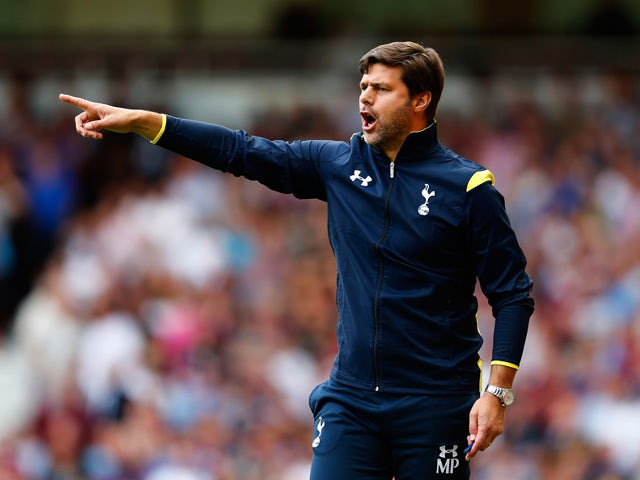 Mauricio Pochettino the Spurs manager directs his players during the Barclays Premier League match between West Ham United and Tottenham Hotspur at Boleyn Ground on August 16, 2014