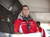Reserve driver Alexander Rossi of the United States and Marussia looks on from the pit wall during practice ahead of the Hungarian Formula One Grand Prix at Hungaroring on July 25, 2014