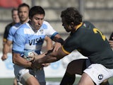 Argentina's Los Pumas' wing Lucas Gonzalez Amorosino runs through a tackle by South Africa's Springboks' hooker Bismarck du Plessis during the Rugby Championship second round match at Padre Ernesto Martearena stadium in Salta, some 1580 km northwest of Bu