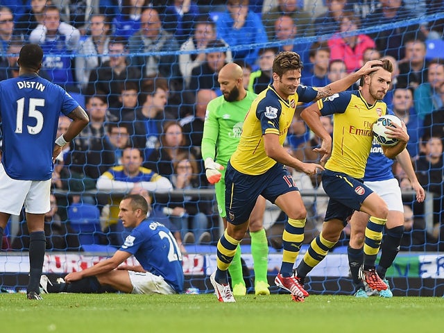 Aaron Ramsey of Arsenal celebrates scoring his team's first goal during the Barclays Premier League match between Everton and Arsenal at Goodison Park on August 23, 2014