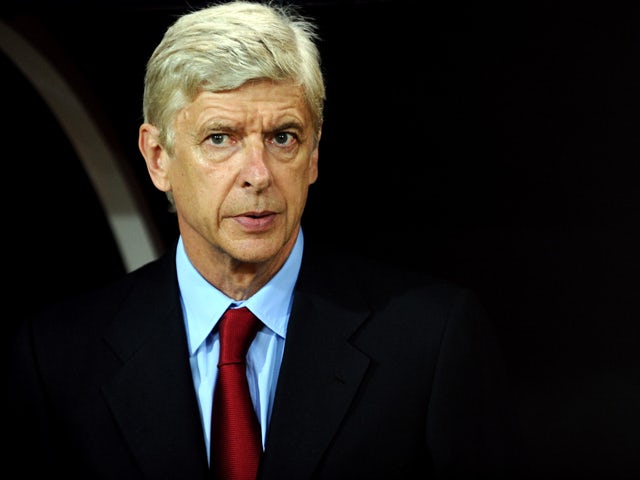 Arsenal's manager Arsene Wenger waits for the begining of the UEFA Champions League play-off football match Besiktas vs Arsenal at Ataturk Olympic Stadium on August 19, 2014