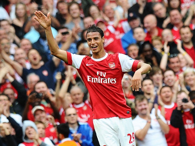 Arsenal's French striker Marouane Chamakh celebrates after he scores the sixth goal of the English Premier League football match between Arsenal and Blackpool at the Emirates Stadium in London, England on August 21, 2010