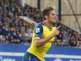 Arsenal's French striker Olivier Giroud celebrates scoring the equalising 2-2 goal during the English Premier League football match between Everton and Arsenall at Goodison Park in Liverpool, northwest England on August 23, 2014