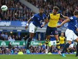 Olivier Giroud of Arsenal scores his team's second goal during the Barclays Premier League match between Everton and Arsenal at Goodison Park on August 23, 2014