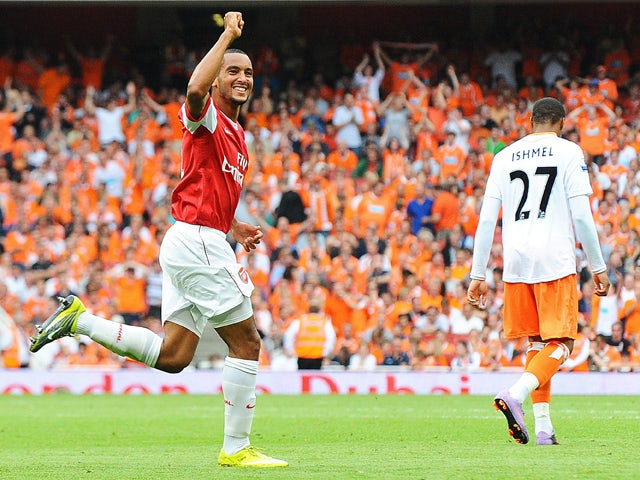 Arsenal's English striker Theo Walcott celebrates after scoring a third goal during the English Premier League football match between Arsenal and Blackpool at the Emirates Stadium in London, England on August 21, 2010