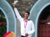 Gold medalist Ben Dijkstra of Great Britain celebrates during the medal ceremony in the Men's Triathlon on August 18, 2014