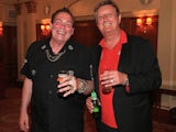 Bobby George and Eric Bristow, both former darts players, are pictured during the Pound 4 Pound Charity fundraiser for Fight4change on May 7, 2014