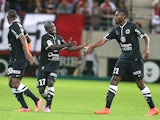 Caen's teammates celebrate after Caen's French midfielder N'golo Kante scored during the French L1 football match Reims (SR) vs Caen (SMC) on August 23, 2014