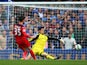 Thibaut Courtois of Chelsea saves from David Nugent of Leicester City during the Barclays Premier League match between Chelsea and Leicester City at Stamford Bridge on August 23, 2014