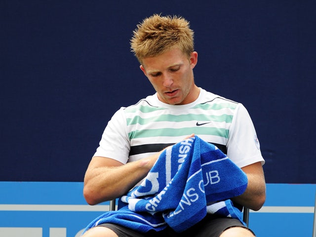 Daniel Cox of Great Britain takes a break during his Men's Singles first round match against James Ward of Great Britain on day one of the AEGON Championships at Queens Club on June 6, 2011
