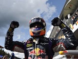 Red Bull Racing's Australian driver Daniel Ricciardo celebrates in the parc ferme at the Spa-Francorchamps circuit in Spa on August 24, 2014