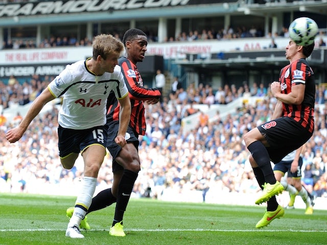 Tottenham Hotspur's English defender Eric Dier (L) scores their second goal past Queens Park Rangers' English midfielder Joey Barton (R) during the English Premier League football match on August 24, 2014