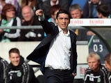 Hanover's coach Tayfun Korkut gestures during the German first division Bundesliga football match Hannover 96 v FC Schalke 04, at HDI-Arena in Hanover, Germany on August 23, 2014