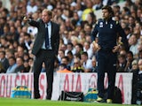 Harry Redknapp (L), the QPR manager gives instructions watched by Mauricio Pochettino, the Spurs manager during the Barclays Premier League match on August 24, 2014