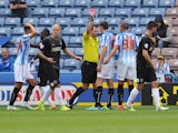  Murray Wallace of Huddersfield Town is sent off by referee Tim Robinson during the Sky Bet Championship match between Huddersfield Town v Charlton Athletic at Galpharm Stadium on August 23, 2014