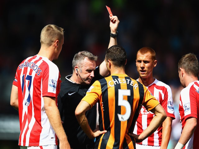 (2) James Chester of Hull City (5) is show a red card by referee Jonathan Moss and is sent off during the Barclays Premier League match on August 24, 2014