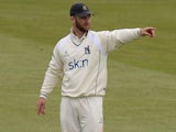 Jim Troughton of Warwickshire setting the fielders during the LV County Championship match between Northamptonshire and Warwickshire at The County Ground on June 15, 2014