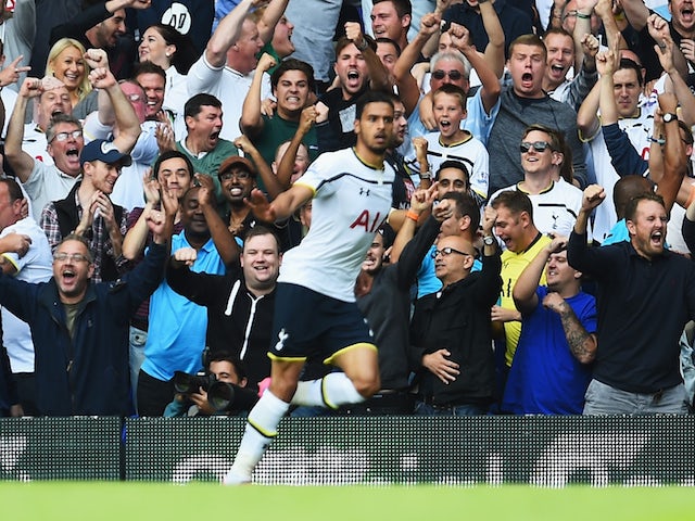 Spurs fans celebrate the opening goal by Nacer Chadli of Spurs during the Barclays Premier League match against QPR on August 24, 2014