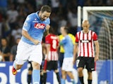 Napoli's Argentinian forward Gonzalo Higuain celebrates after scoring during the first leg of the UEFA Champions League play off football match between SSC Napoli and Bilbao Athletic Club in San Paolo Stadium on August 19, 2014