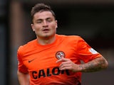 Paul Paton of Dundee United in action during the Scottish Premier League match between Dundee United and Inverness Caledonian Thistle at Tannadice Park on August 10, 2013